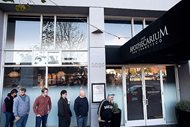 Customers wait for the opening of recreational marijuana sales at The Apothecarium on Saturday in San Francisco. An announcement that the Department of Justice would no longer adopt a "hands-off" approach to legalized marijuana use sent some in the industry into a tailspin just days after the $1 billion California recreational weed market opened for business. 