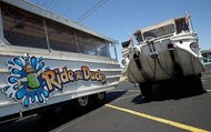 Duck boats sit idle in the parking lot of Ride the Ducks on July 21 in Branson, Mo. One of the company's duck boats capsized on July 19 resulting in 17 deaths on Table Rock Lake.
