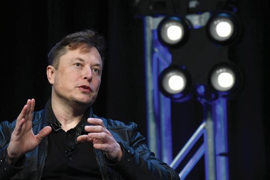 Tesla and SpaceX CEO Elon Musk speaks at the Satellite Conference and Exhibition in Washington. Musk’s trial is set to start Tuesday over a misleading tweet about a potential buyout of the electric automaker, setting the stage for the mercurial billionaire to be thrust into a legal drama amid the turmoil of his Twitter takeover.