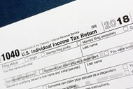 A portion of the 1040 U.S. Individual Income Tax Return form for 2018. The $1.5-trillion tax overhaul includes the end of a 75-year-old deduction on alimony payments.